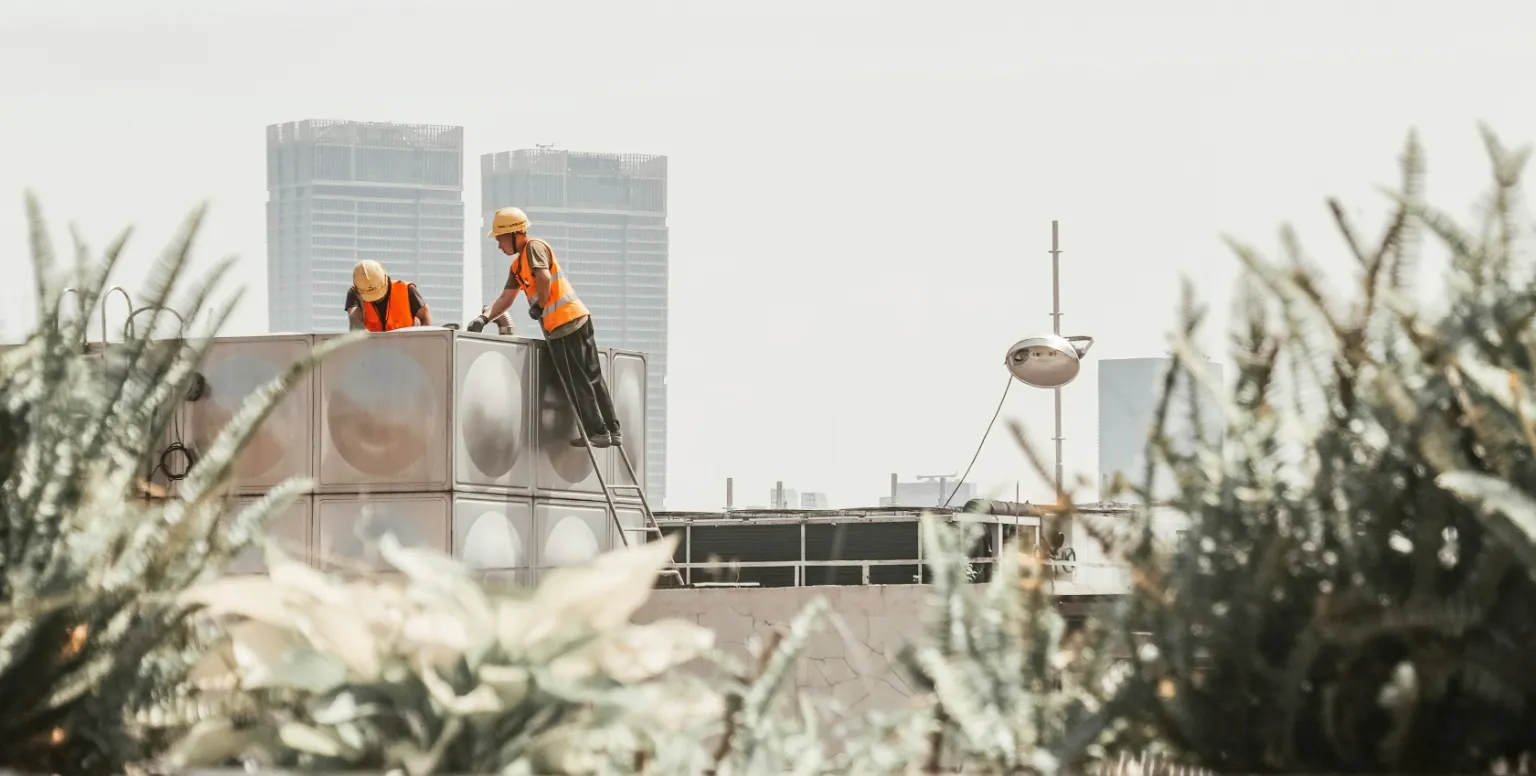 Technicians working on a building unit