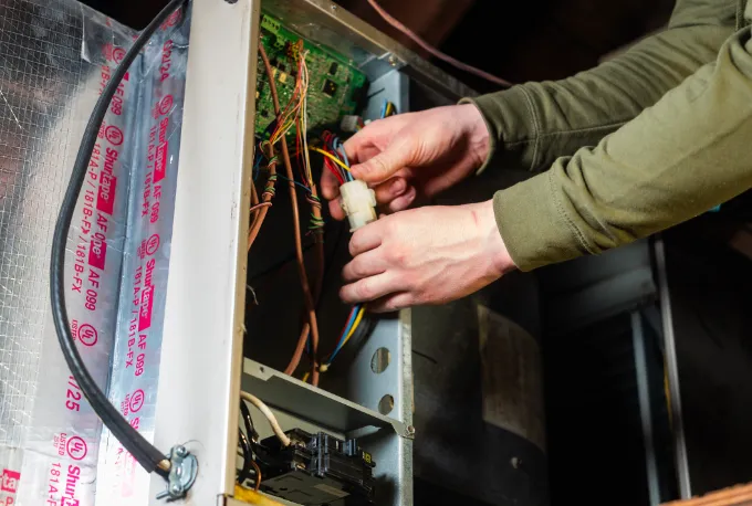 Gary Paul Mechanical technician holding fuse
